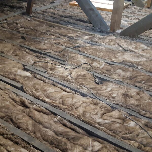 11 installation of 100mm base layer loft insulation